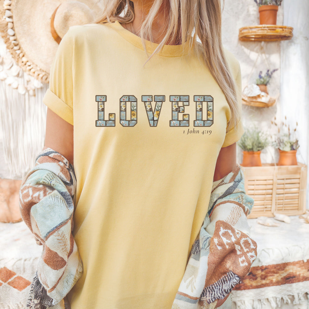 Loved Christian Tee – 1 John 4:19 Faith Graphic Shirt