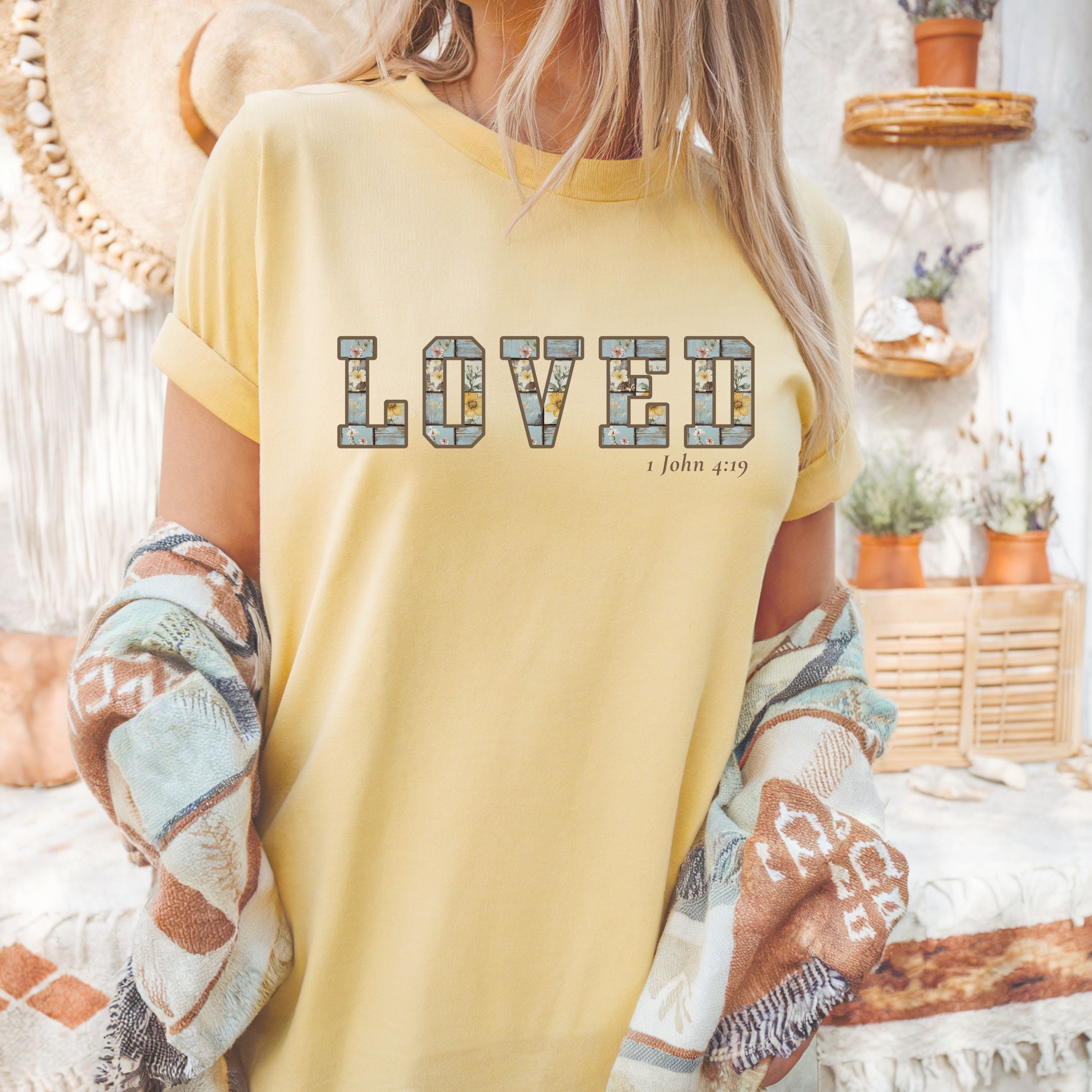 Loved Christian Tee – 1 John 4:19 Faith Graphic Shirt