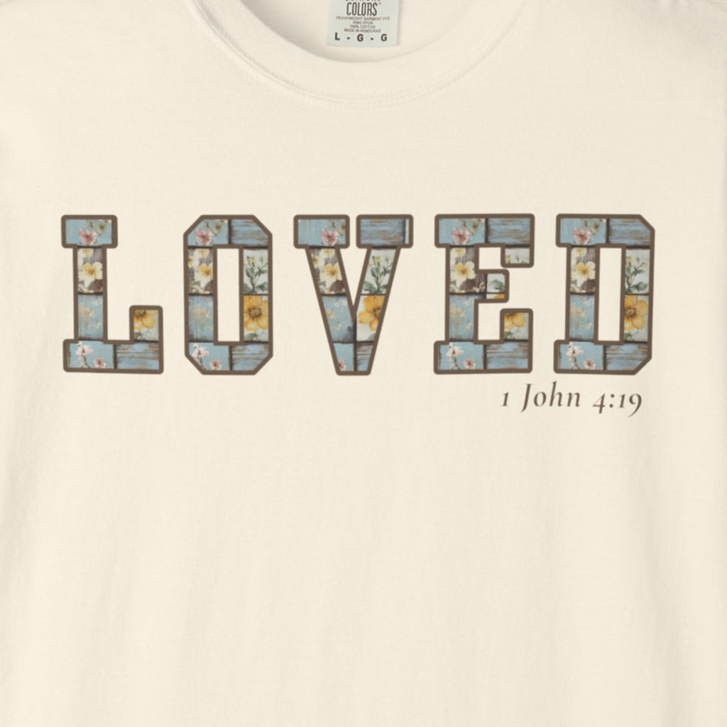 Loved Christian Tee – 1 John 4:19 Faith Graphic Shirt
