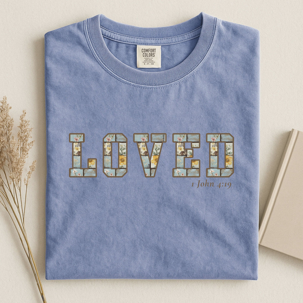 Loved Christian Tee – 1 John 4:19 Faith Graphic Shirt